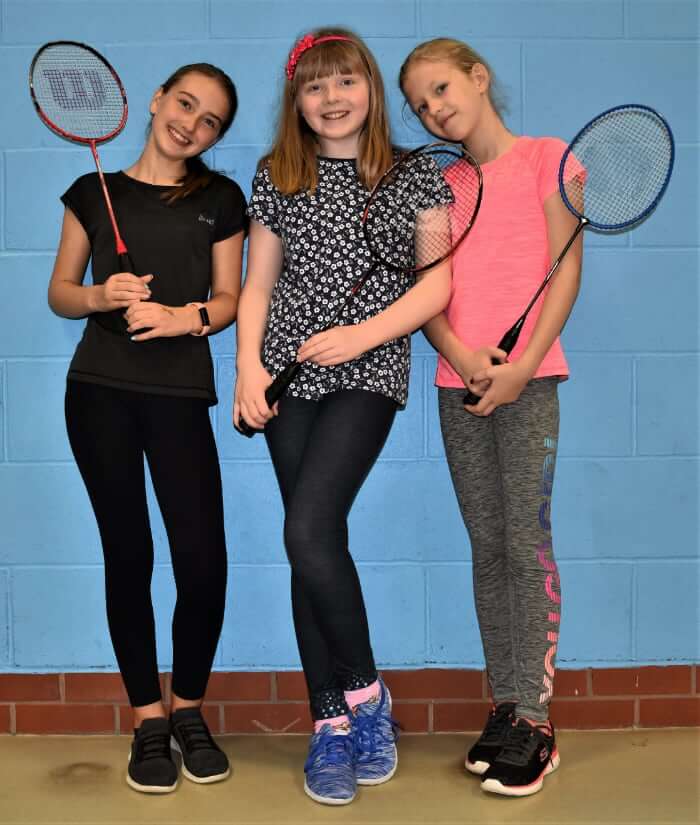 3-girls-holding-rackets